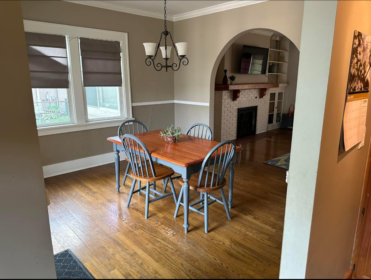 Dining room with wood table and arched doorway